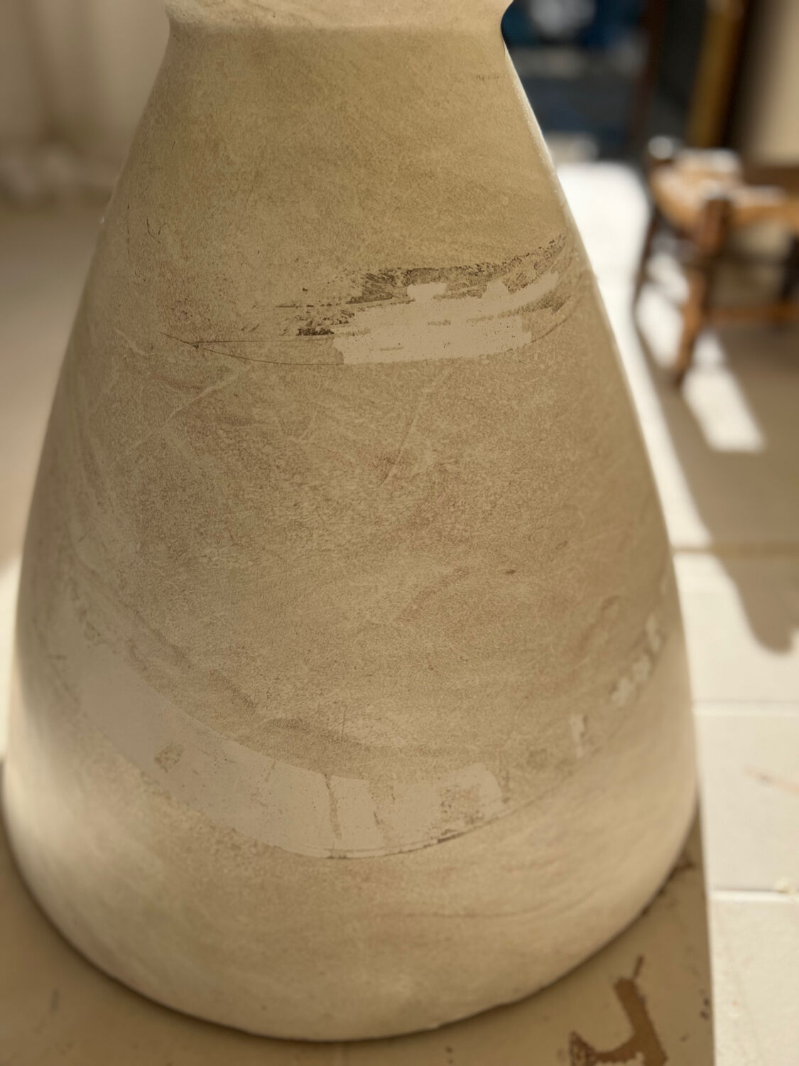 Travertine-effect stone dining table