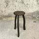 Vintage tripod plant stand with curved legs.