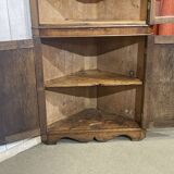 19th-century English corner cabinet in oak, mahogany, and fir.