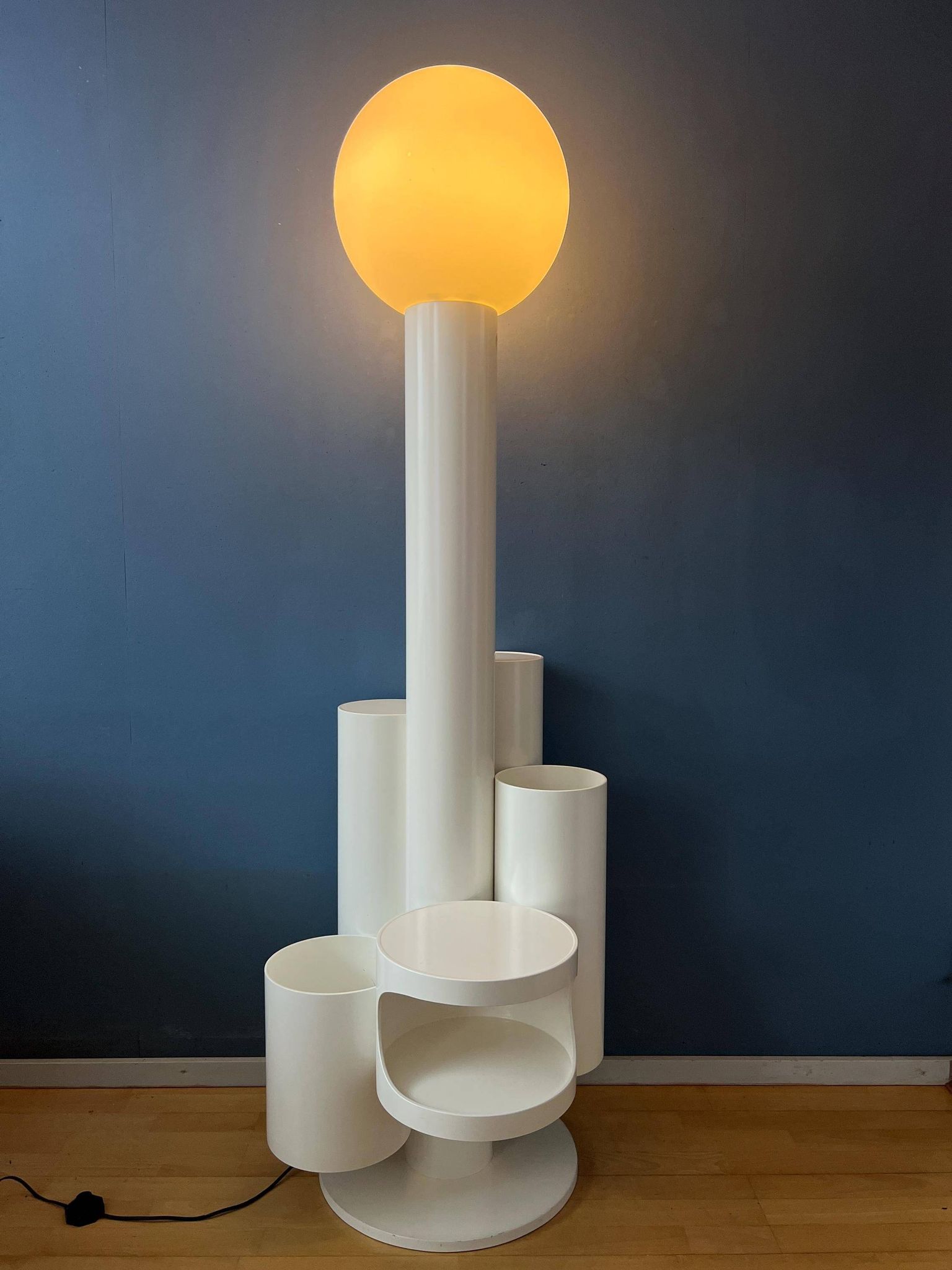 White floor lamp "Close Encounter" and plant stand by Kerst Koopman