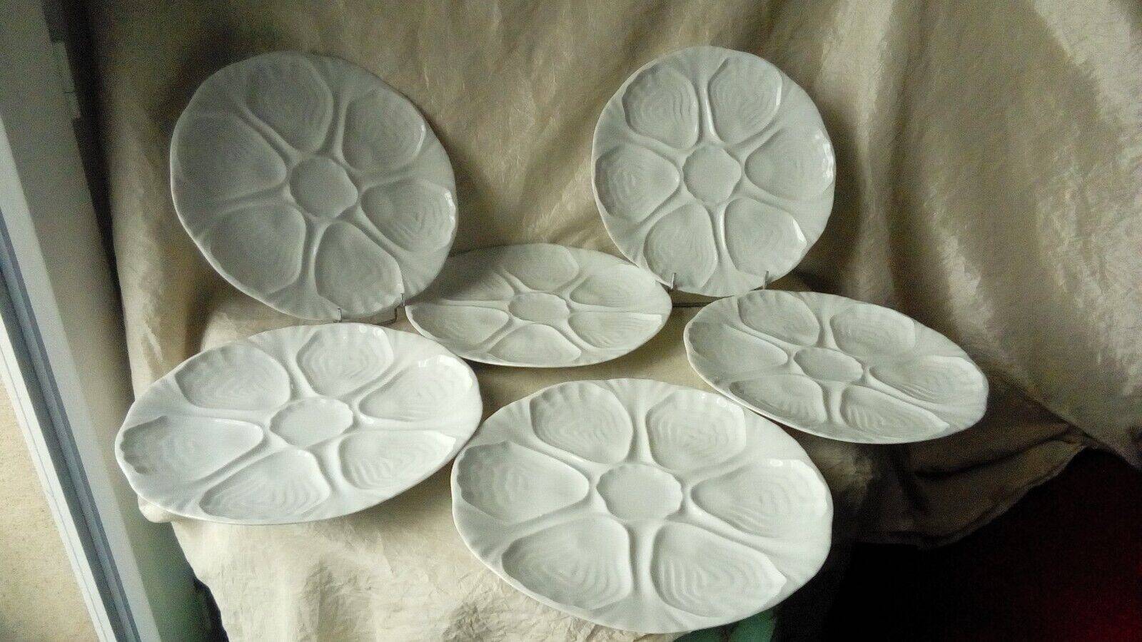 White porcelain oyster plates