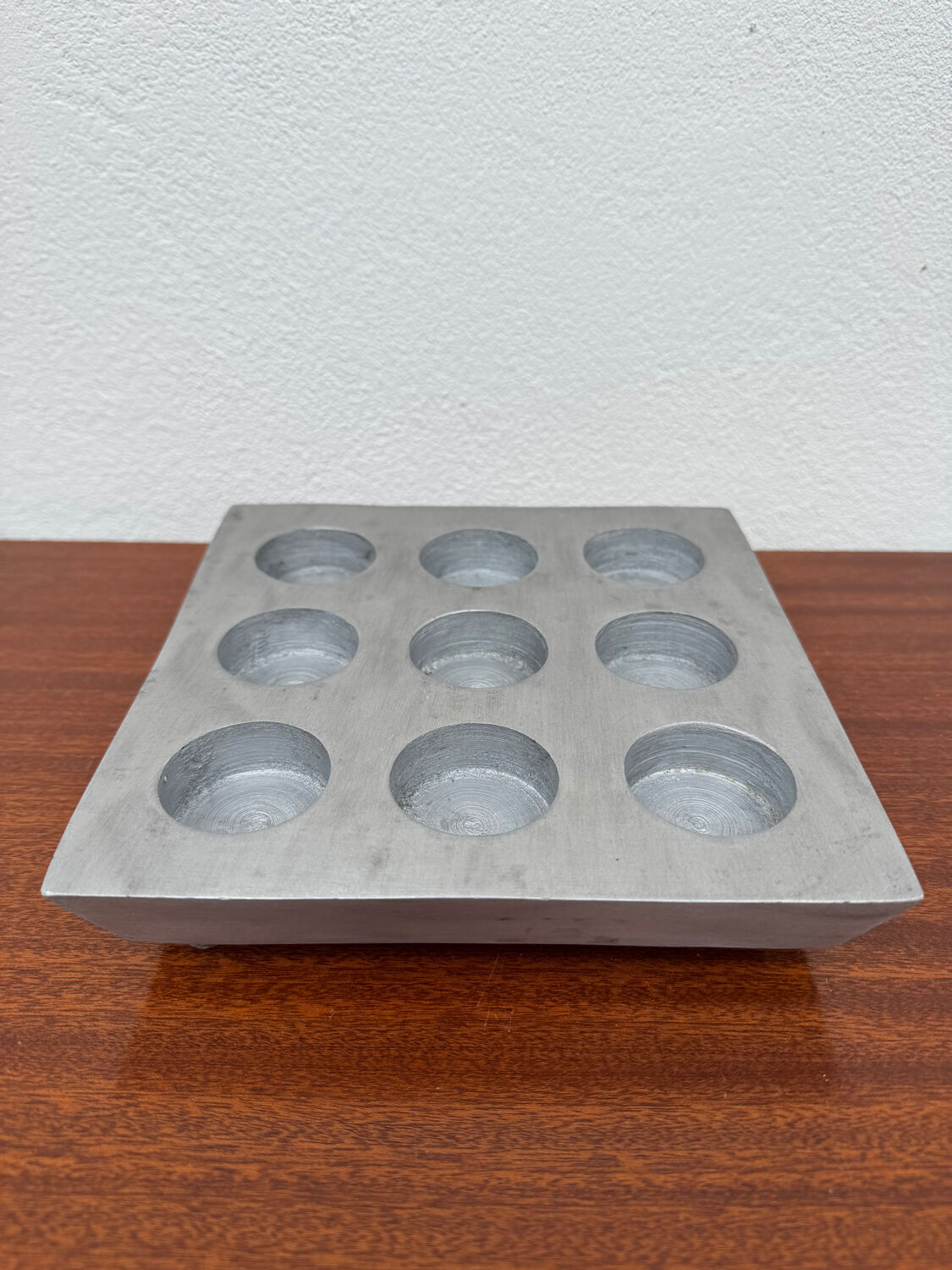 Brutalist style brushed aluminum candle holder