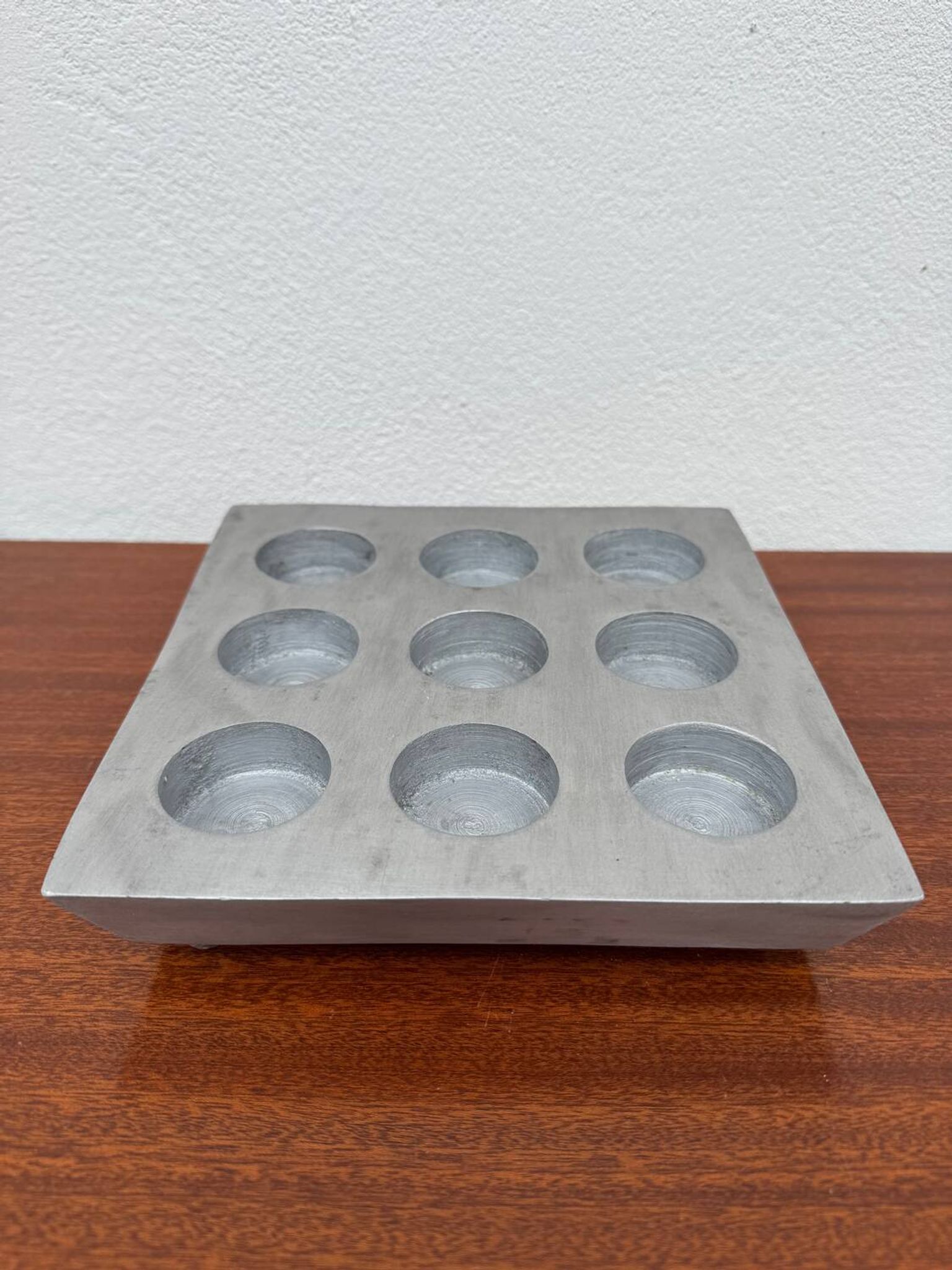 Brutalist style brushed aluminum candle holder