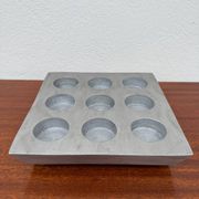 Brutalist style brushed aluminum candle holder