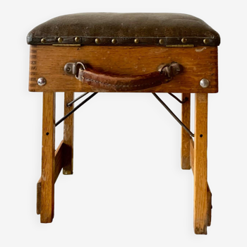 Old foldable fisherman's stool in wood and leather