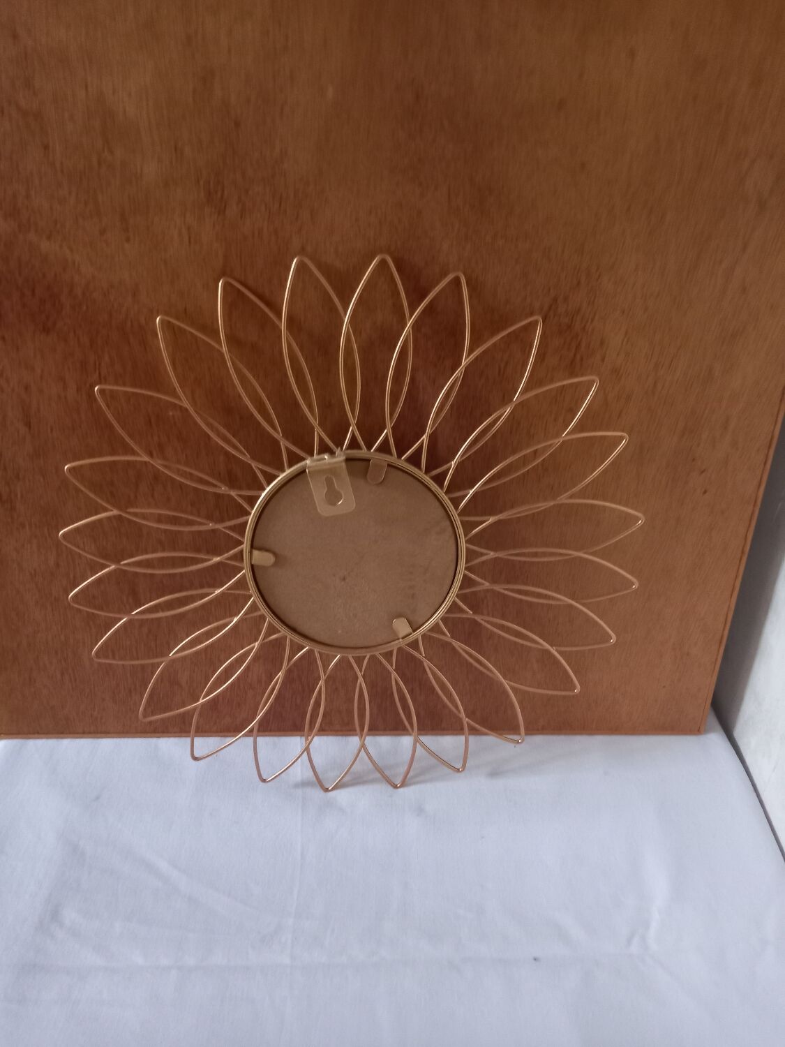 Sun mirror in gilded metal