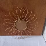 Sun mirror in gilded metal