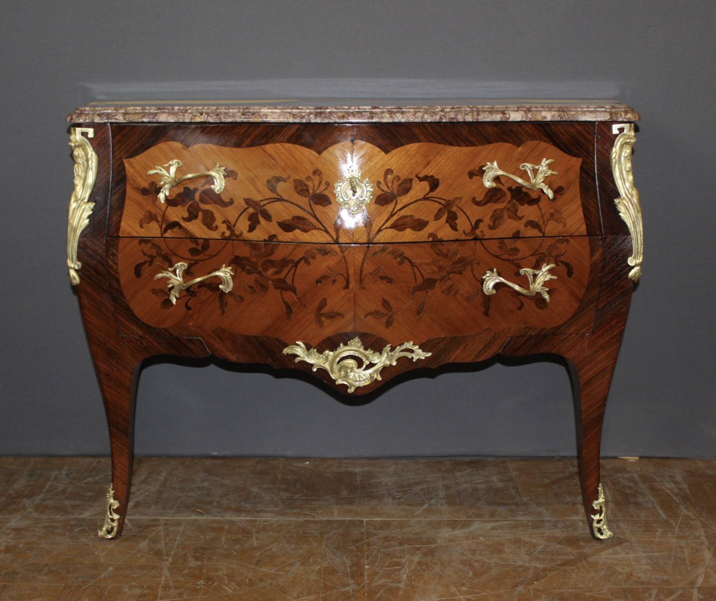Louis XV style commode in marquetry from around 1930.