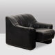Maison De Sede. Armchair and its ottoman in black leather. 1970s.