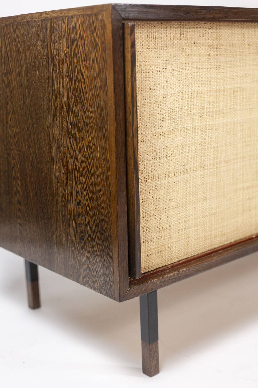 Sideboard in wenge, raffia and lacquered metal. 1970s.