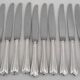 Christofle Spatours, 12 silver-plated table knives, in excellent condition.
