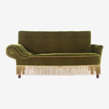 Canapé-lit antique de couleur verte