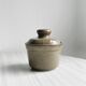 Gray and white speckled ceramic pot.