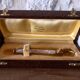 Sugar or ice tongs in their case