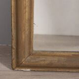 EARLY 20TH CENTURY GOLDEN WOODEN WALL MIRROR DECORATED IN BAROQUE STYLE