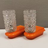 Bathroom lamps in a nice orange colour with a crystal glass shade and a base of hard thin plastic
