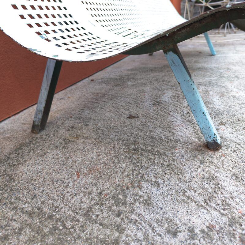 Public bench made of perforated iron