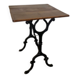 Bistro table with iron legs and raw wood top