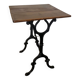 Bistro table with iron legs and raw wood top.