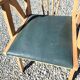 Compass leg armchair