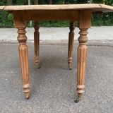 Renovated 18th century solid wood extendable round dining table with shutters