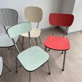 10 mismatched multicolored Formica chairs 60s