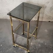 Side Table 1970s smoked glass/gold/wheels
