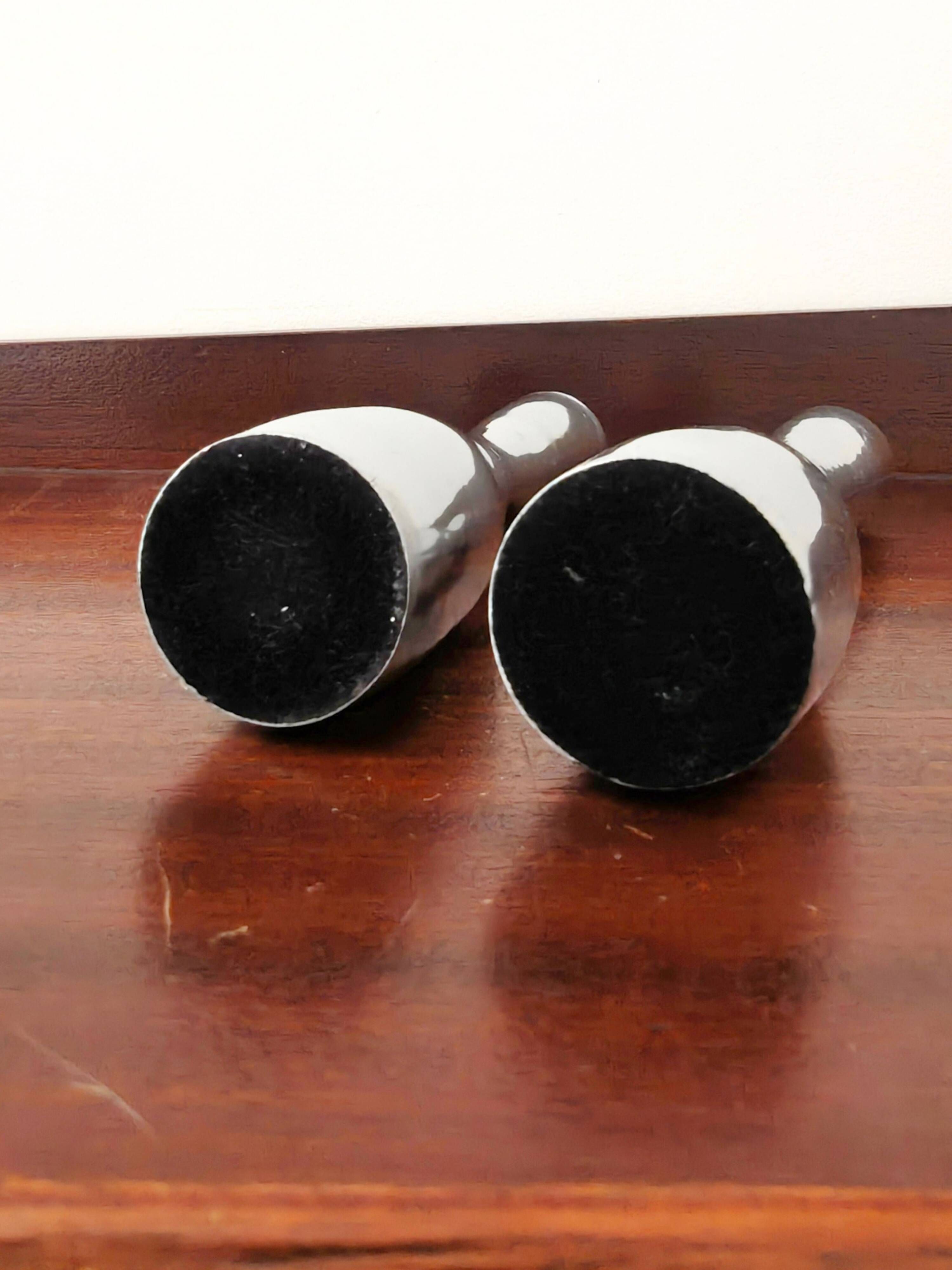 Pair of minimalist aluminium candlesticks in the style of Erika Pekkar.