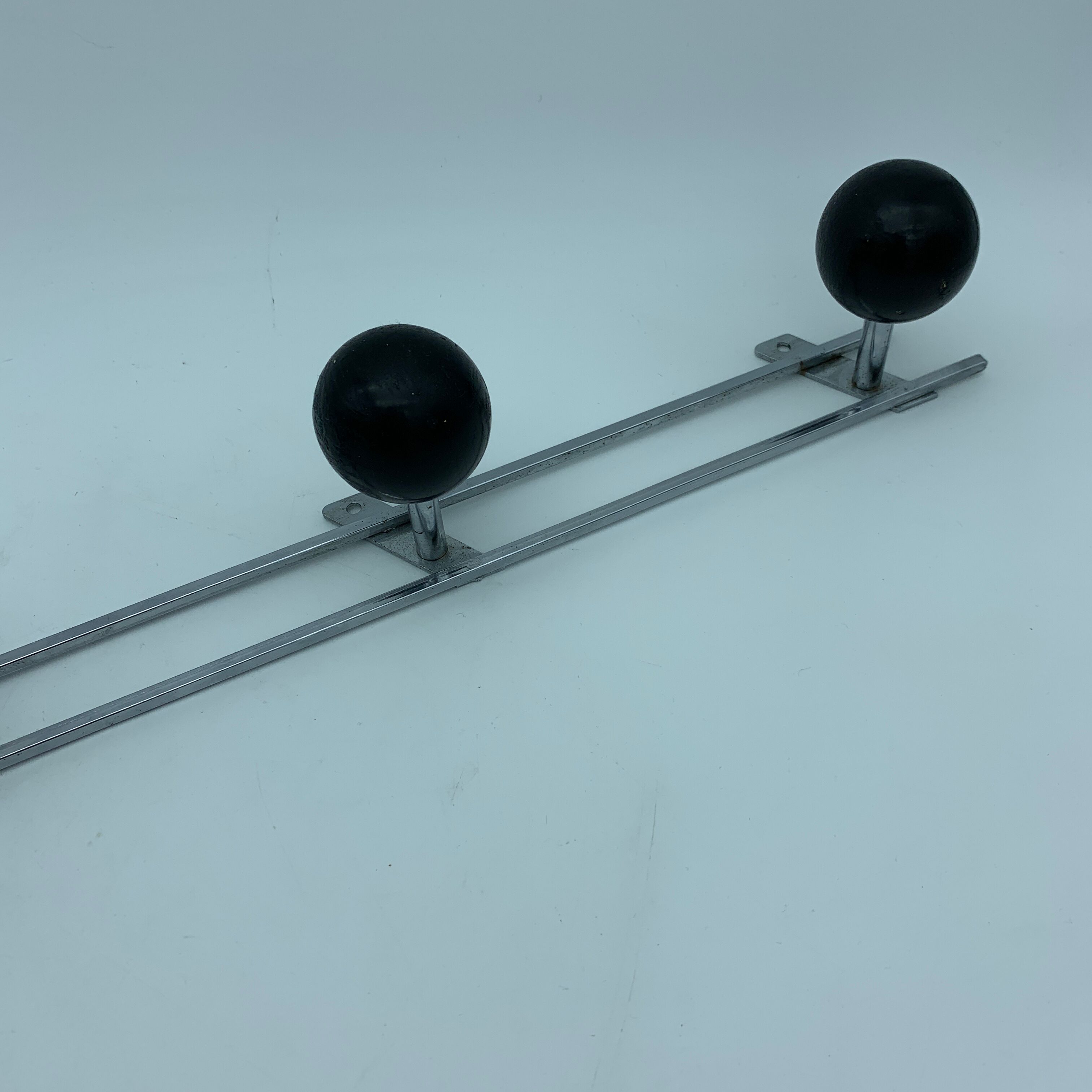 Coat holder 4 chrome steel pateres and black wooden balls