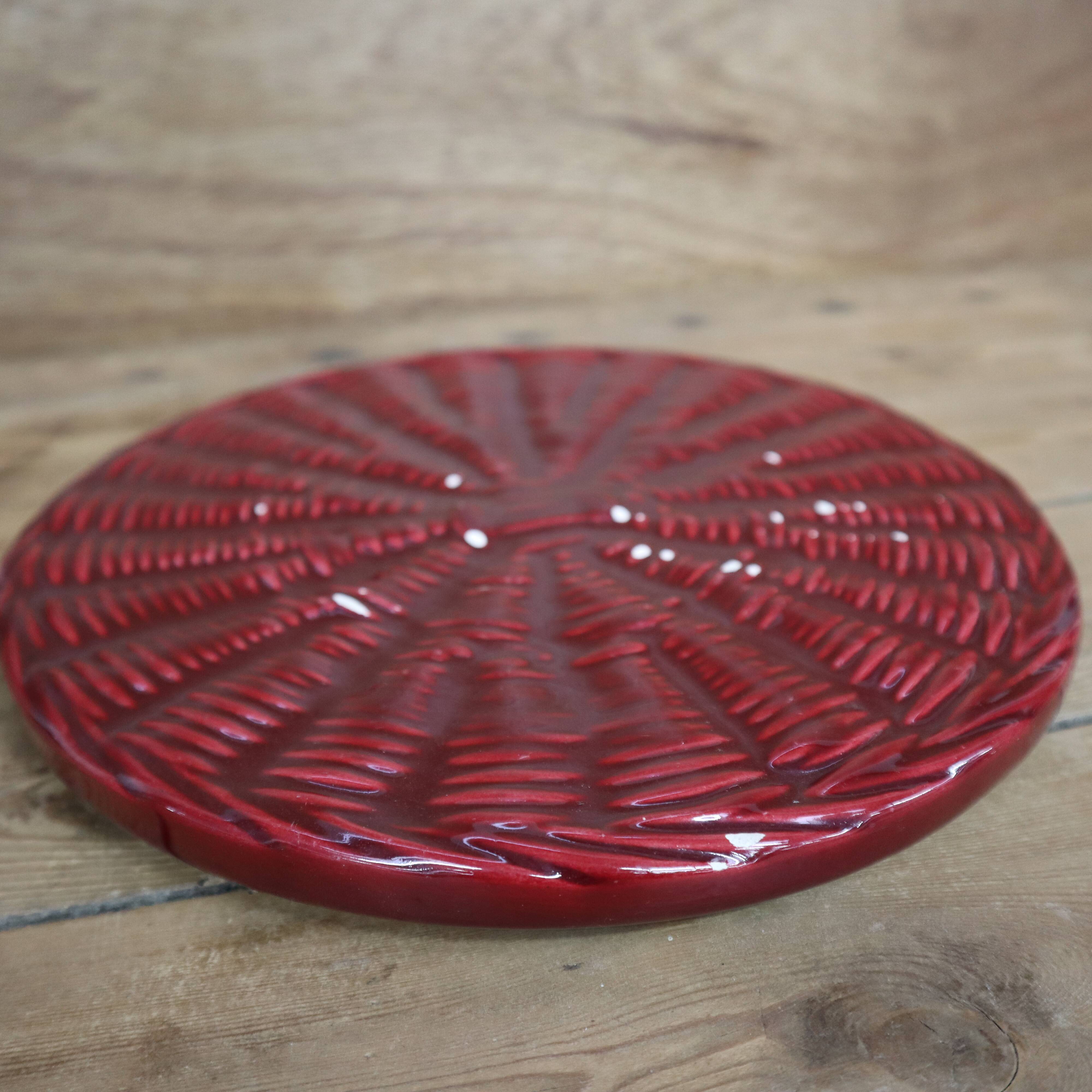 Burgundy slip tray and its small vintage knife from the 50s