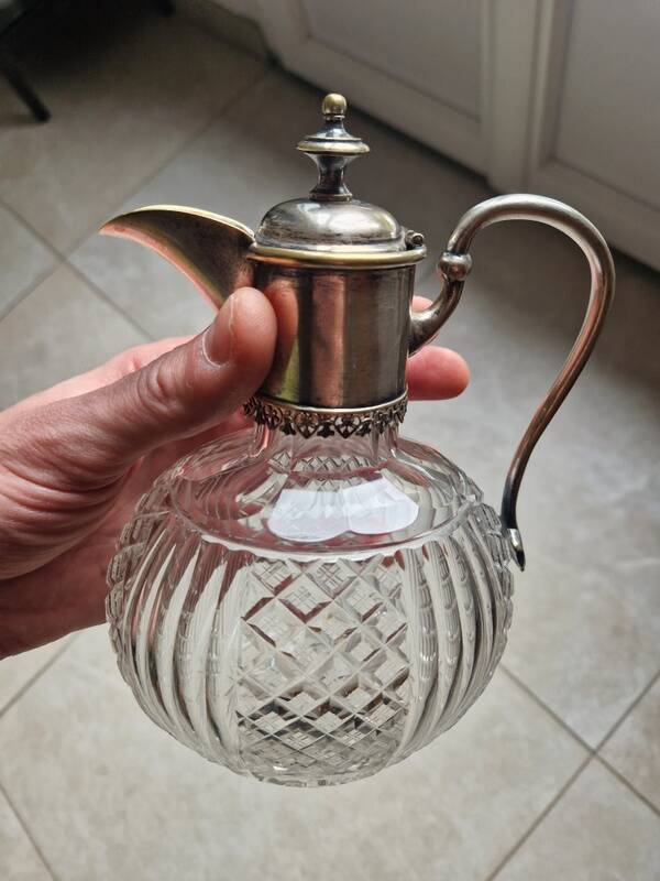 Cut crystal carafe and silver-plated metal