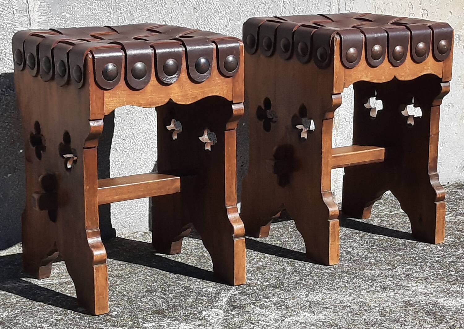 Pair of brutalist stools, leather seat.