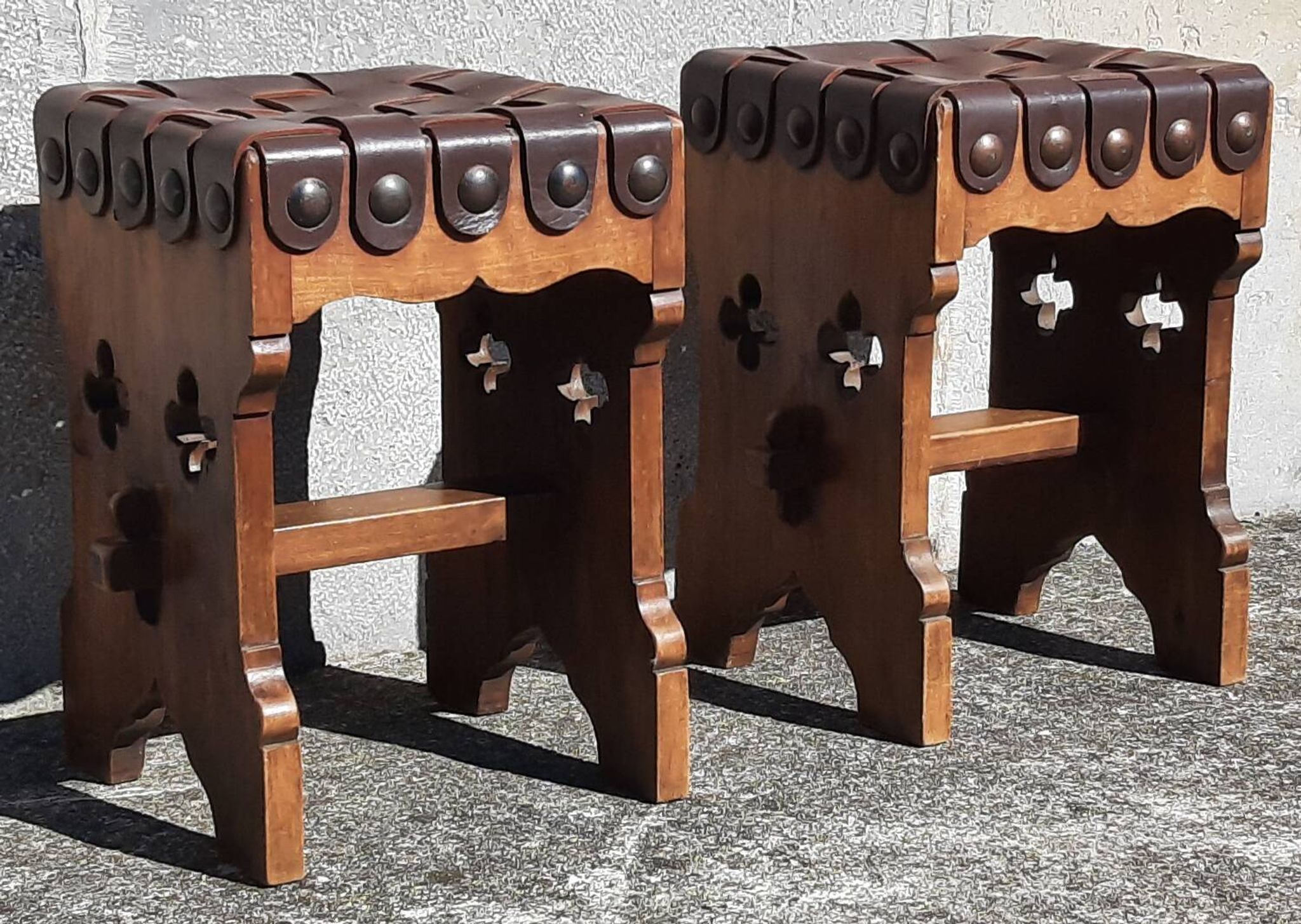 Pair of brutalist stools, leather seat.