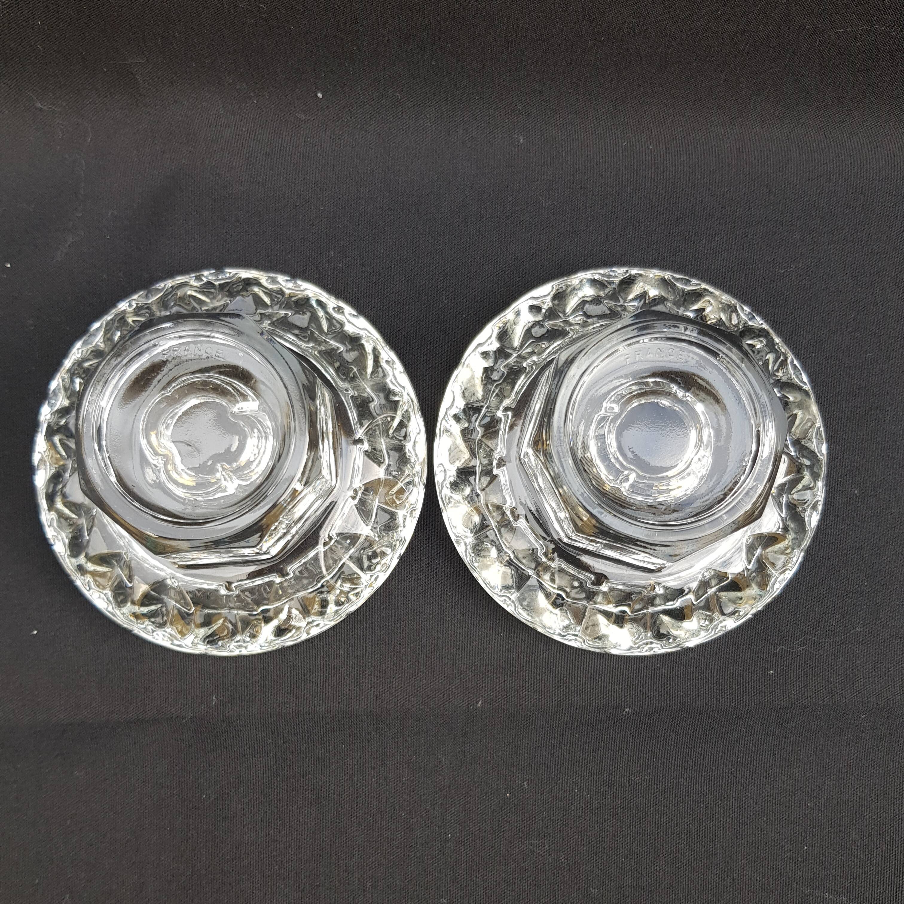 Duo of old glass candlesticks