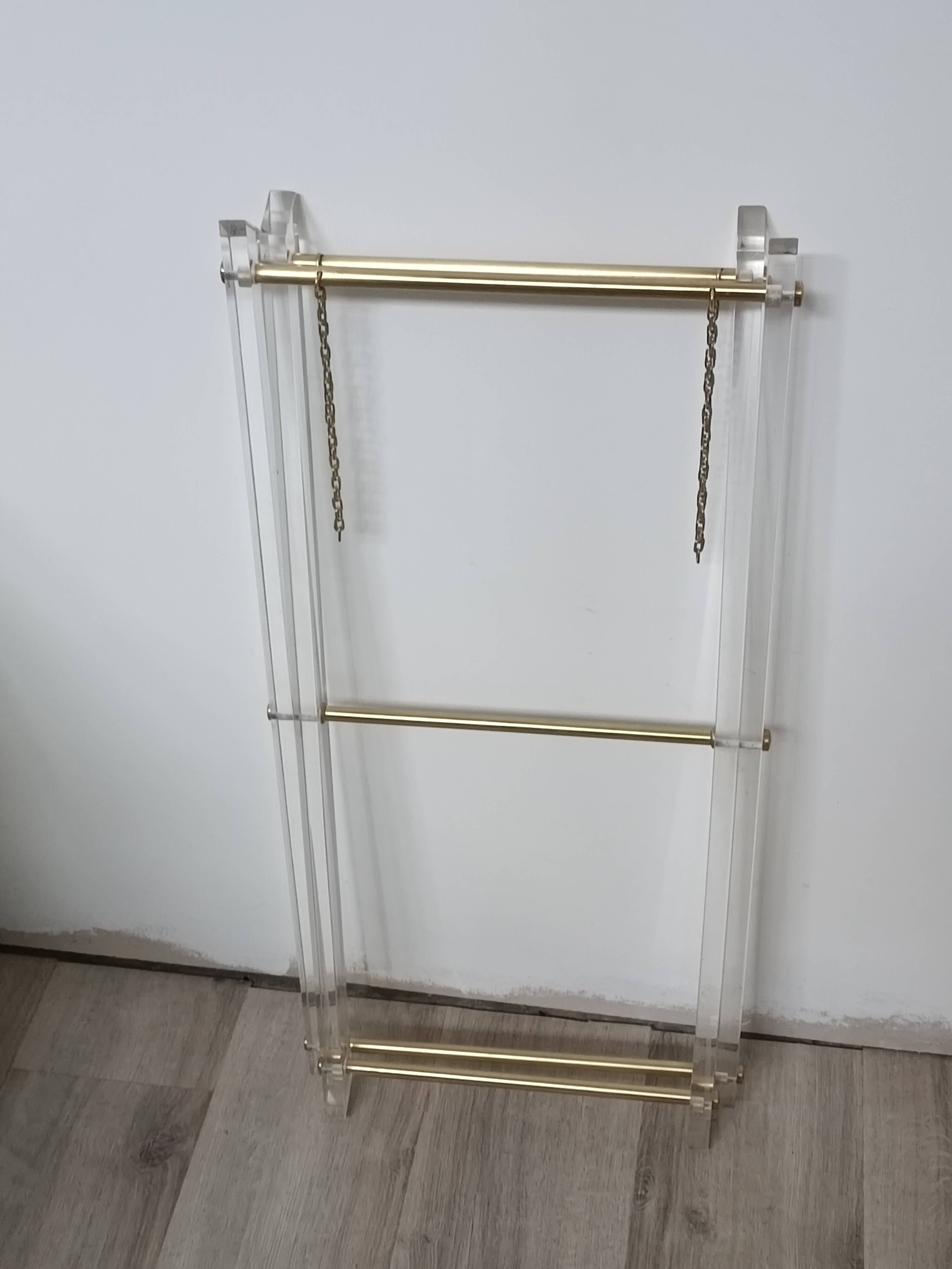 Folding side table in plexiglass and brass, 1970s.