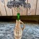 Rattan bottle with handle