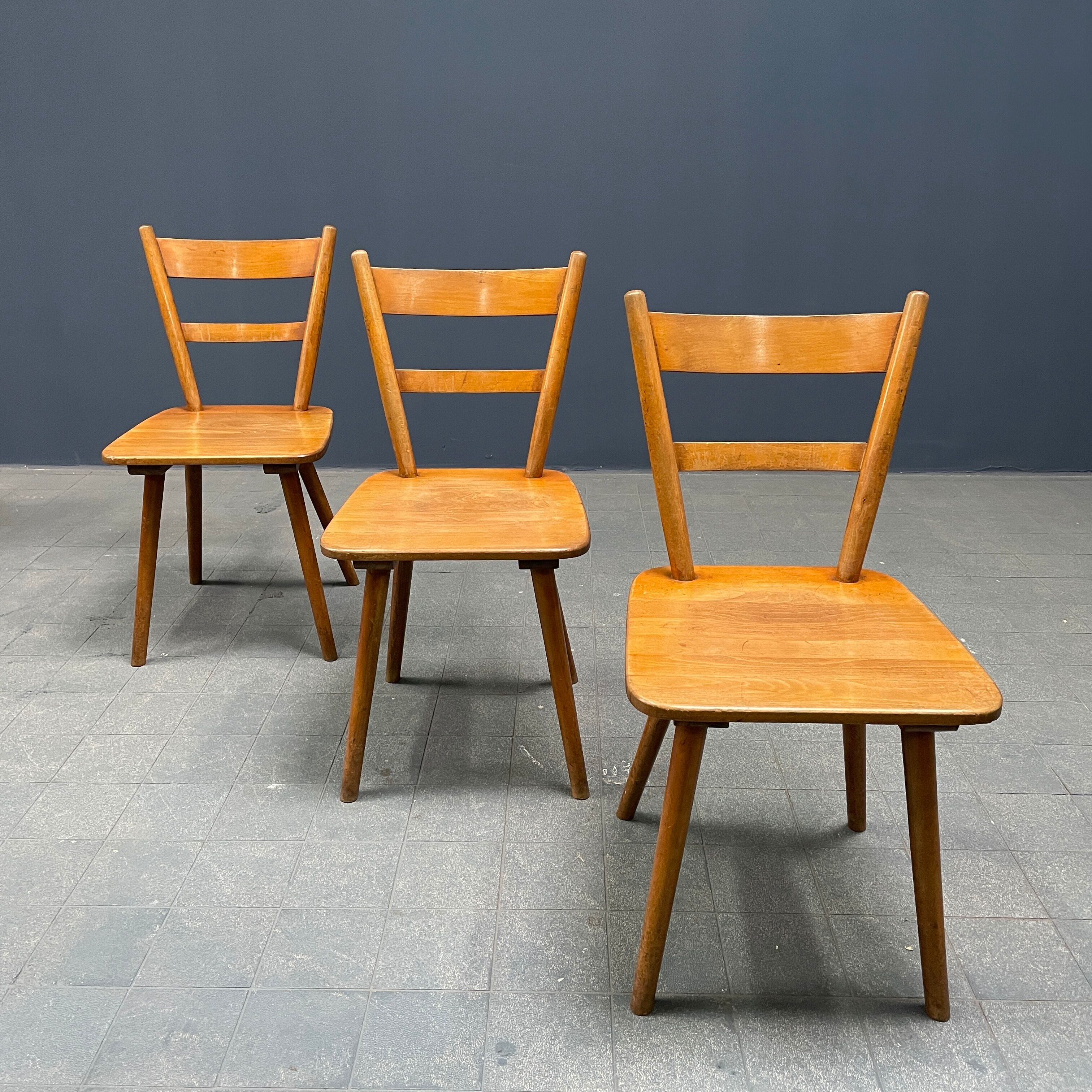 Set of eight german stick chairs from the 1950