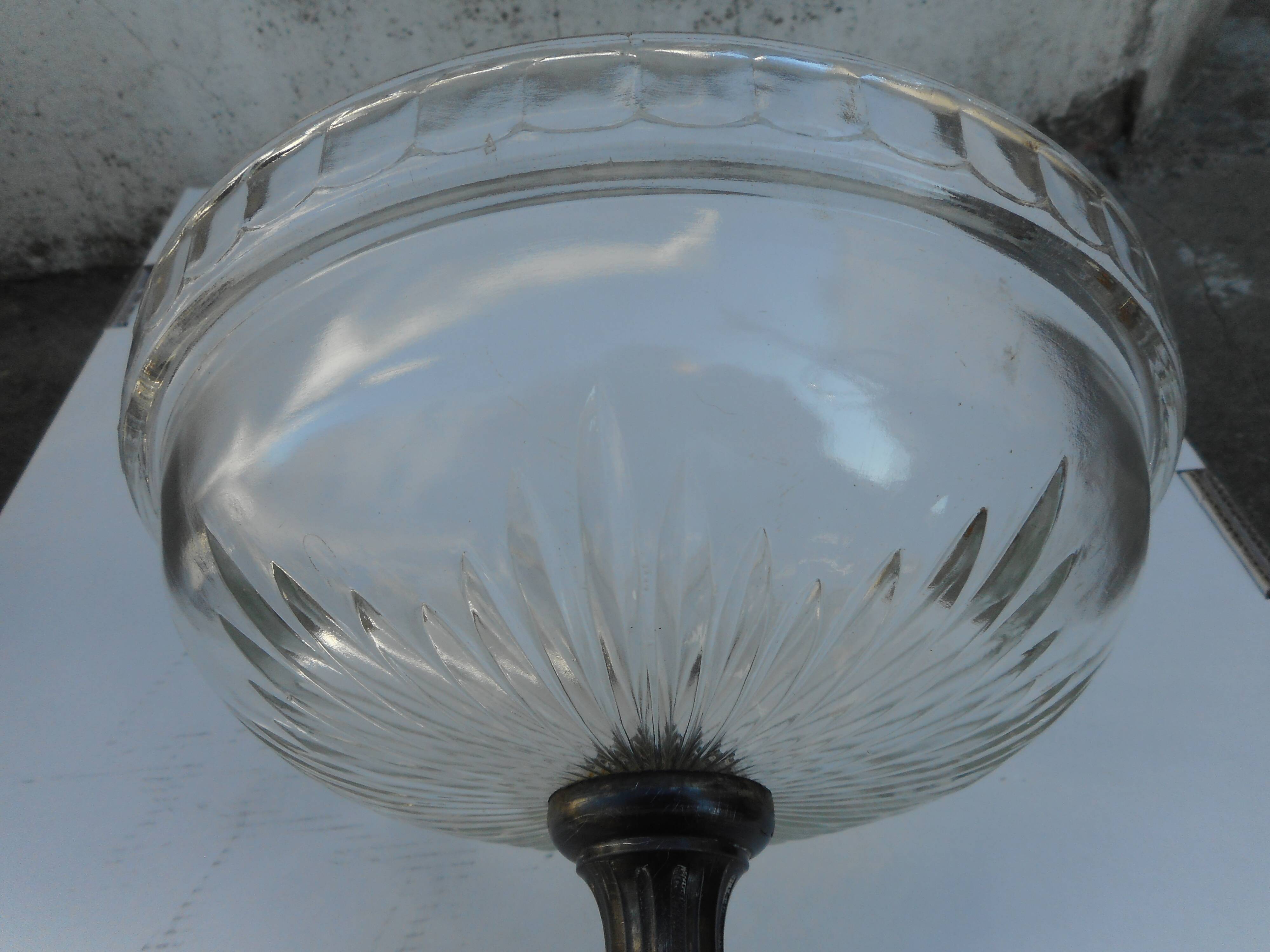 A glass cup on metal stand