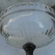 A glass cup on metal stand