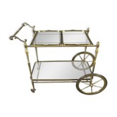 Rolling table cart in gilded brass with two glass shelves, 20th century.