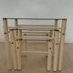 Nested tables by Boutboul in cream metal and smoked glass, circa 1970.