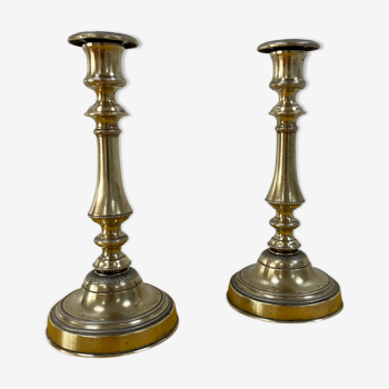 Pair of brass chiseled candlesticks