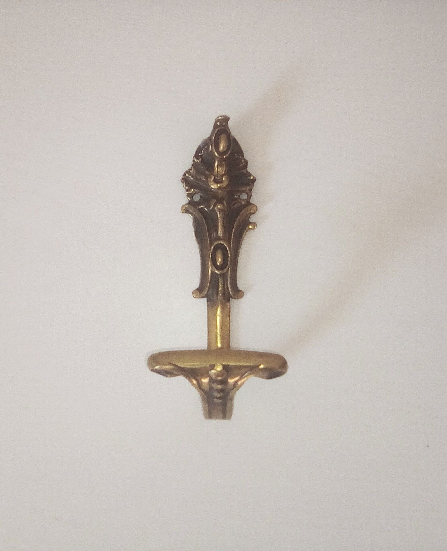 Old brass coat rack hook