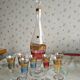 Liqueur set, colored and golden glasses and carafe