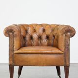 Fauteuil chesterfield sur roulettes en cuir de mouton