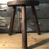 Wooden milking stool on tripod base