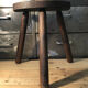 Wooden milking stool on tripod base