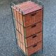Metal chest of drawers and four woven wicker baskets