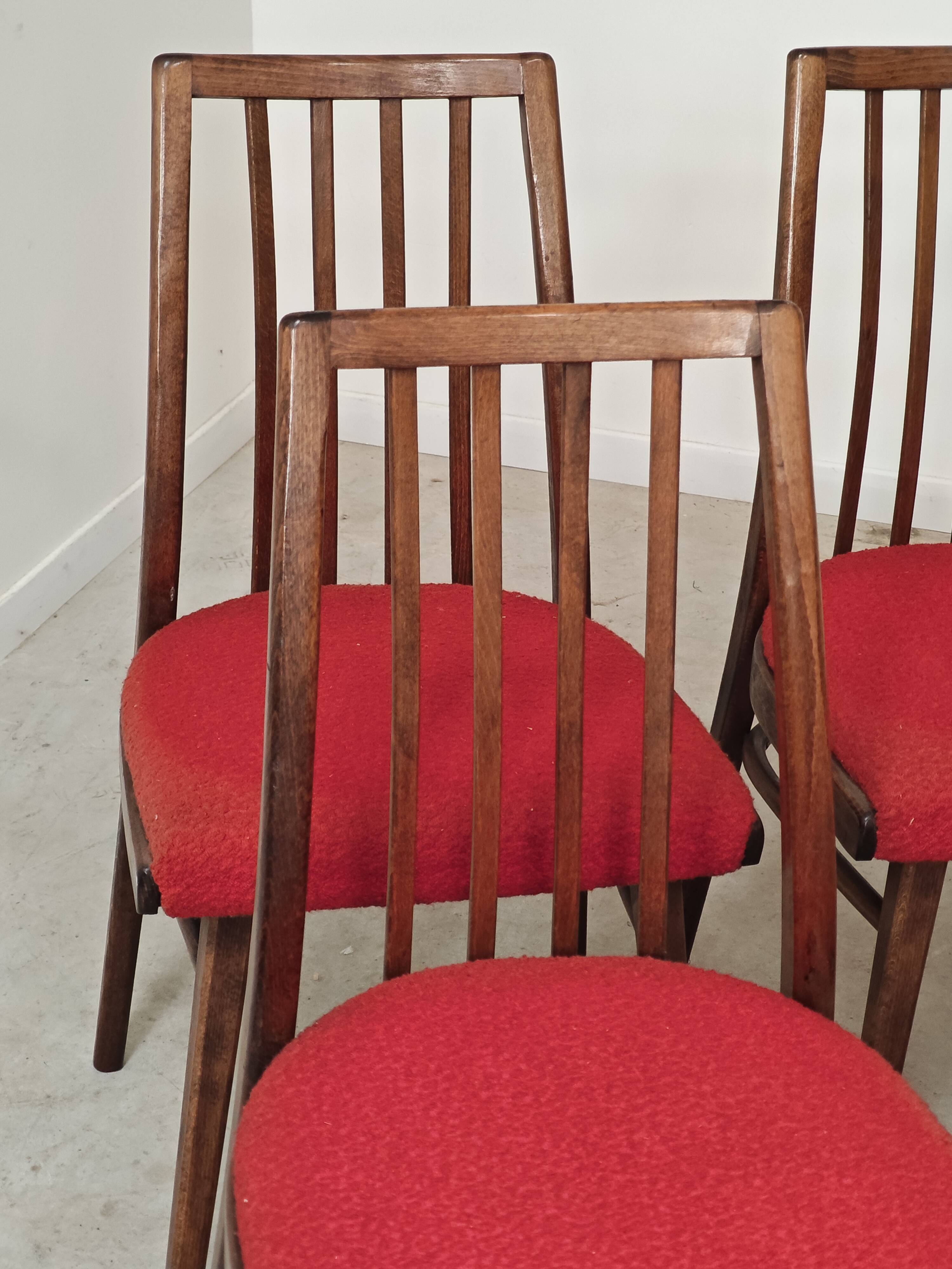 Set of 4 red dining chairs by Antonin Suman for Interier Praha.