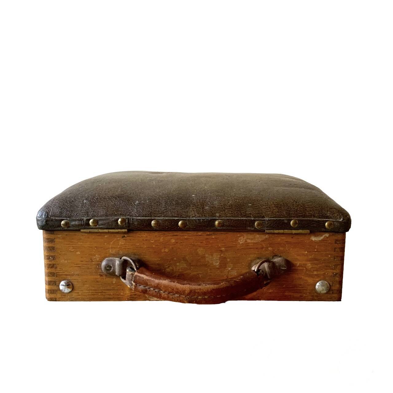 Old foldable fisherman's stool in wood and leather